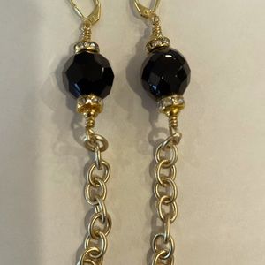 Earings 3.5 inches long, gold color with black crystal and diamond crystals.